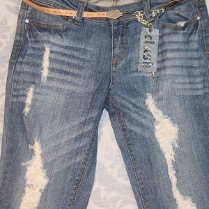 Women’s Skinny Distressed Mid Blue Jeans with Decorative Tag